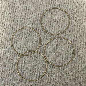 4 large gold rings 5” across